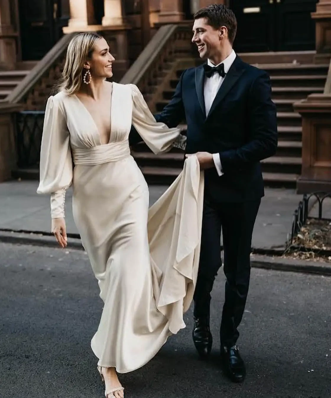 Сouple wearing a white gown and a black suit