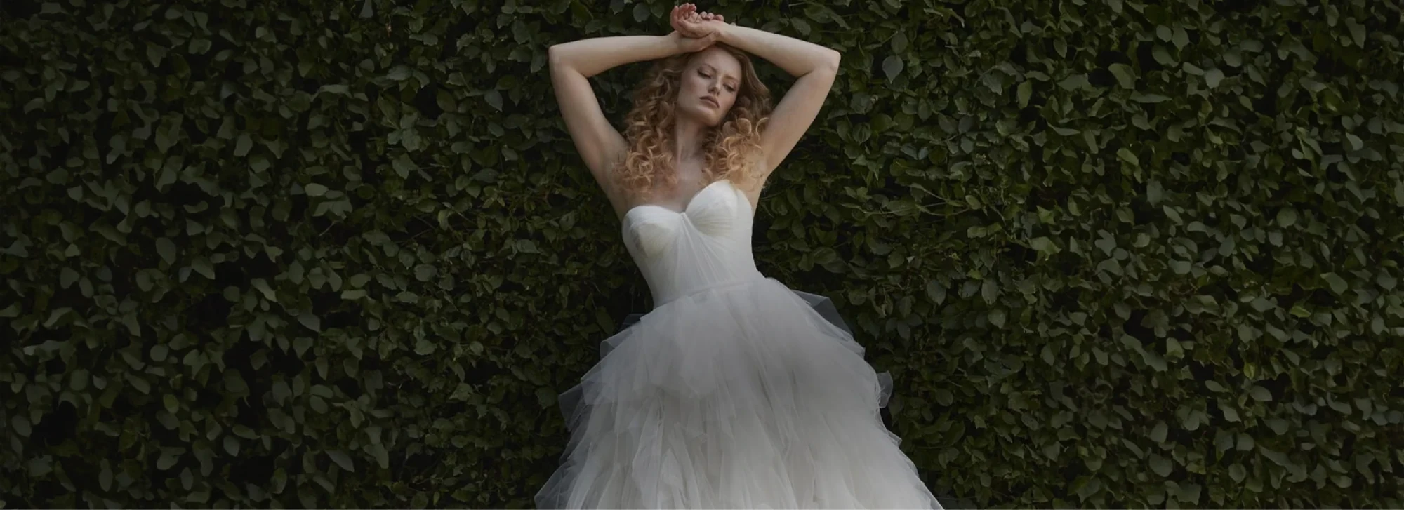 Image 46: Model wearing a white gown by Karin Shemesh